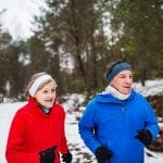 Senior Couple jogging in the snow