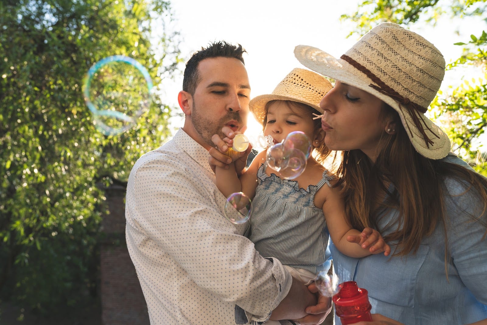 happy family blowing bubbles