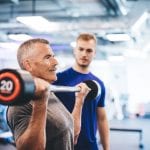 older man lifting weights