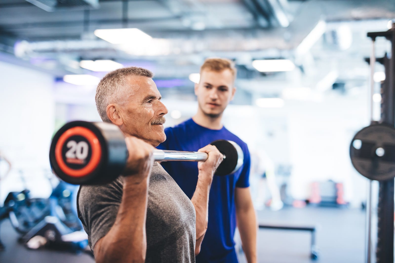 older man lifting weights