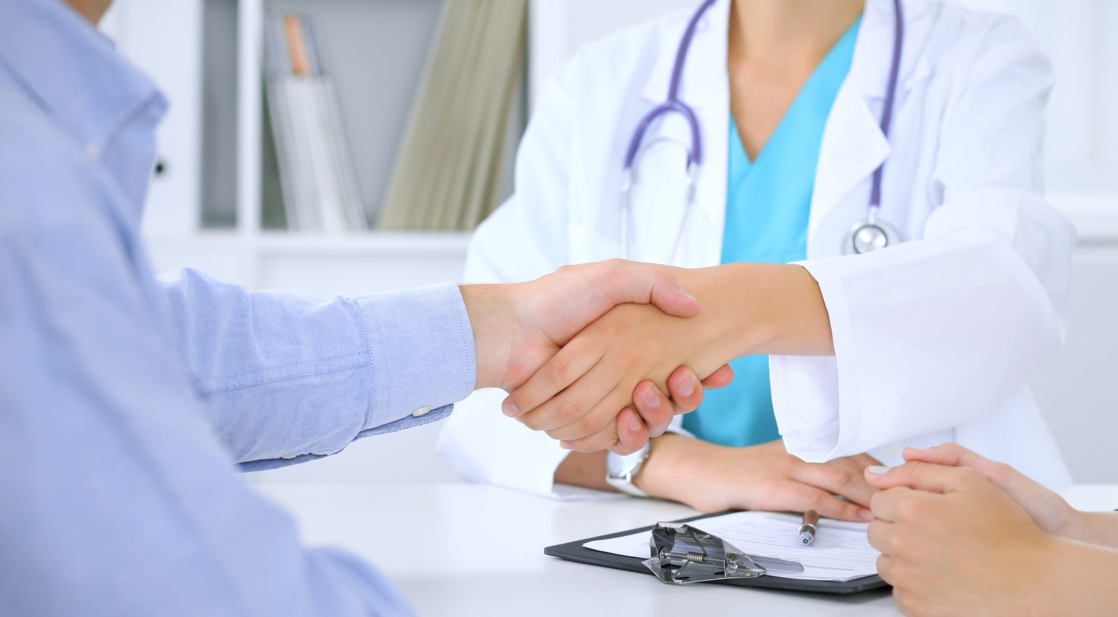 Doctor and patient shaking hands after talking about HRT