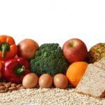 variety of fresh healthy foods fruits vegetables whole grains and dairy.