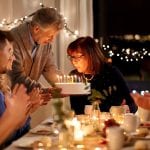 family celebrating a woman's birthday