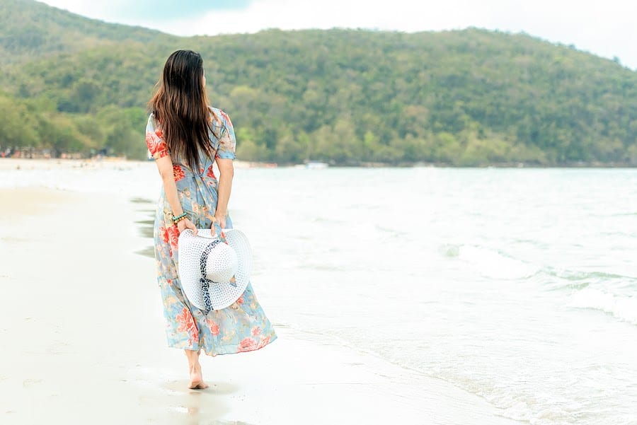 Woman Walking on the Beach